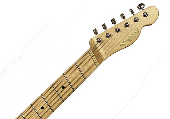Fanned-fret neck against a straight-fret Fender neck